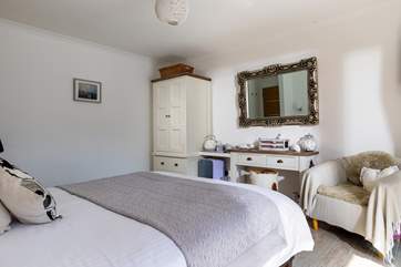 Located on the ground floor this bedroom has a fabulous en suite shower-room and sliding doors which lead out onto the terrace and hot tub.
