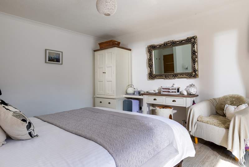 Located on the ground floor this bedroom has a fabulous en suite shower-room and sliding doors which lead out onto the terrace and hot tub. 