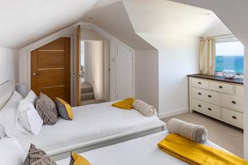 Across the landing, and over four steps, takes you to the very cute twin bedroom.