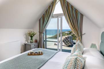 Framed by glass doors, savour the panorama across Porthtowan from the main bedroom’s king bed. Finished with a balcony and en suite shower-room, you’ll never want to leave.