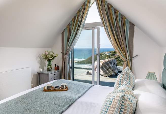 Framed by glass doors, savour the panorama across Porthtowan from the main bedroom’s king bed. Finished with a balcony and en suite shower-room, you’ll never want to leave. 