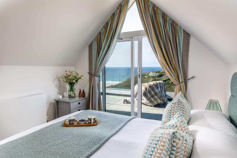 Framed by glass doors, savour the panorama across Porthtowan from the main bedroom’s king bed. Finished with a balcony and en suite shower-room, you’ll never want to leave. 