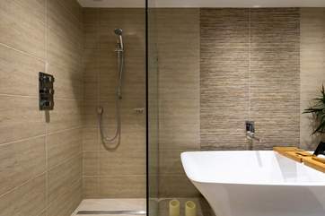 The fabulous family bathroom has the most amazing walk-in shower, perfect for washing away the sand after a day on the beach.