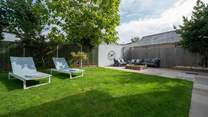 Spill out to the gorgeous garden and enjoy the Island's sunshine. 