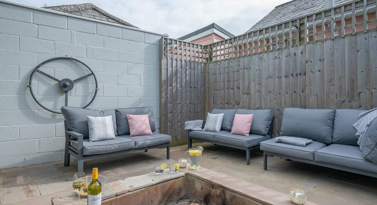 The perfect relaxation corner, with the comfort of sofas and the warmth from the fire-pit, providing the ideal spot for a chilly evening. 