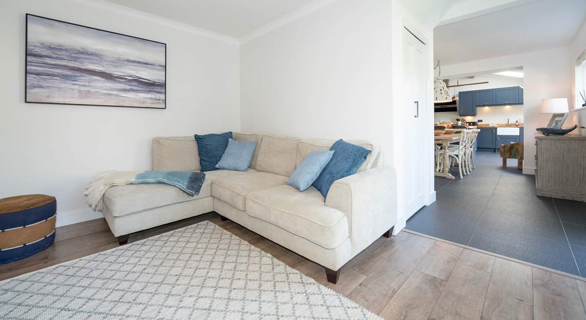 The kitchen/dining-room leads into the comfy sitting-room. 