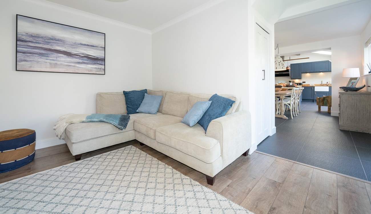 The kitchen/dining-room leads into the comfy sitting-room. 