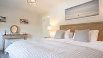 The light and airy first floor main bedroom overlooks the garden...