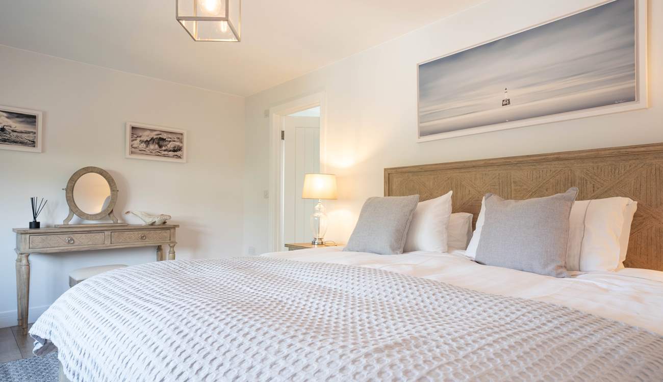The light and airy first floor main bedroom overlooks the garden...