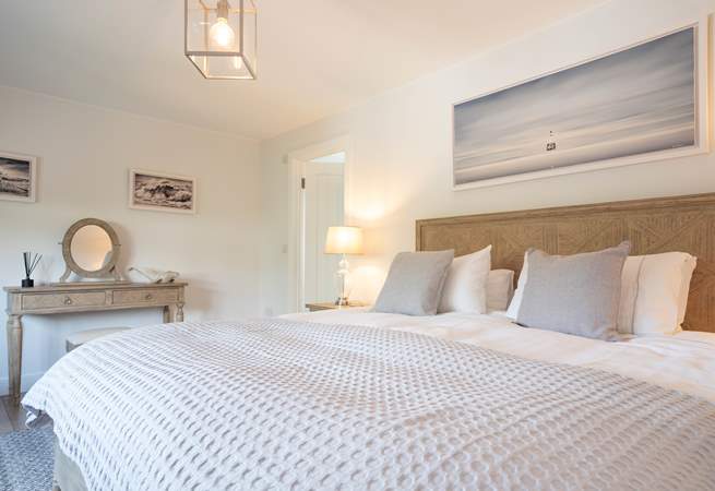 The light and airy first floor main bedroom overlooks the garden...
