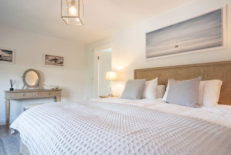 The light and airy first floor main bedroom overlooks the garden...