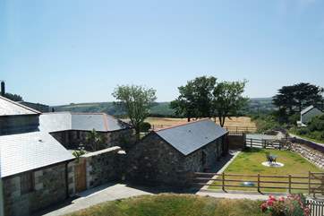 The view from Bedrooms 3 overlooking the converted holiday barns and the valley beyond.