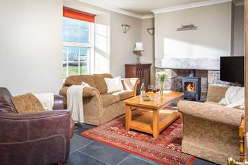 The front sitting-room is lovely and cosy with far reaching views over the countryside.