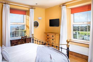 Bedroom 2 has views over the valley and the sea too (the owner is in the process of redecorating in more neutral tones).