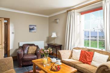 The front sitting-room is lovely and cosy with far reaching views over the countryside. There is a second large sitting room also with a wood burning stove.