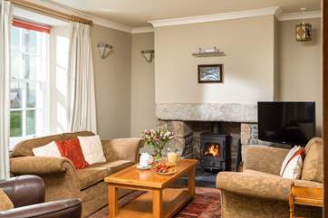 Snuggle down in front of the fire, the front sitting room is lovely and cosy.