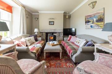 The drawing room at the front of the property is so cosy and snug.