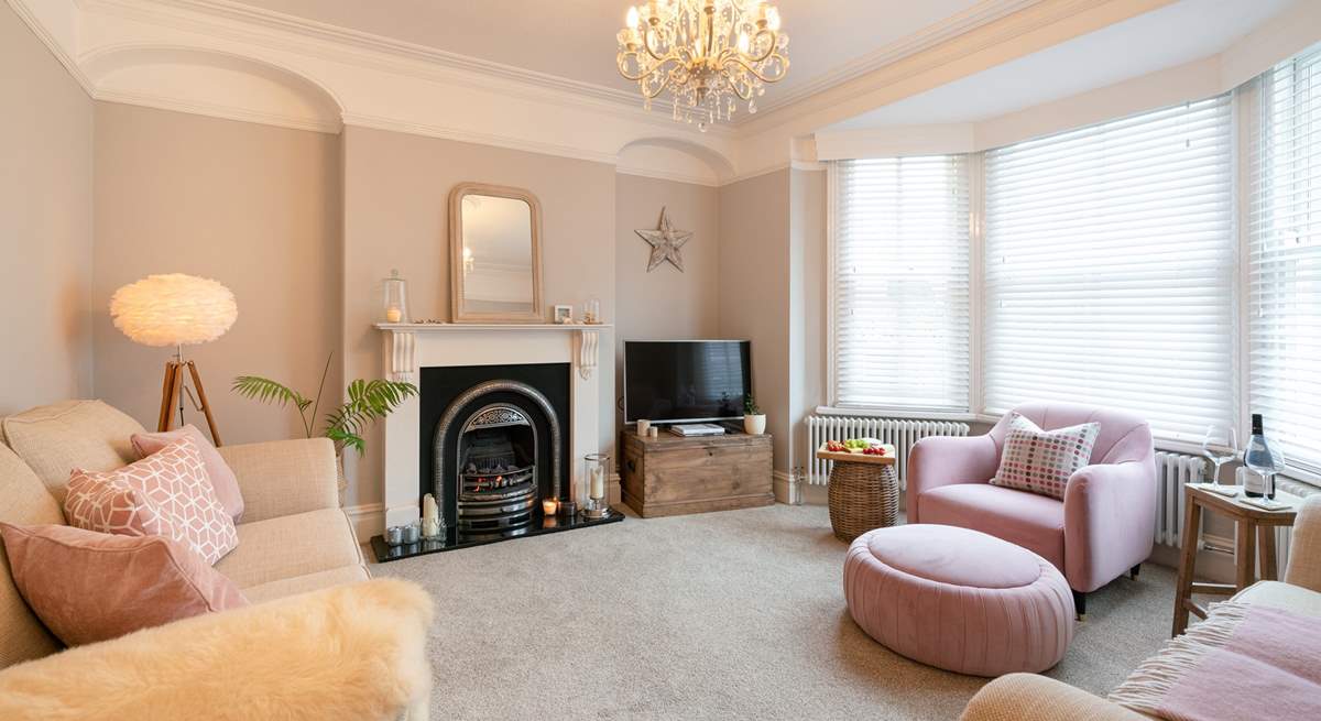 Stylish sitting-room with touches of pink.