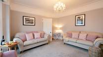 Front sitting-room has flair.