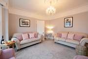 Front sitting-room has flair.