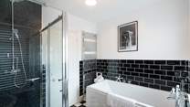 Stylish family bathroom on the first floor.