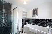 Stylish family bathroom on the first floor.