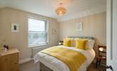 Mellow yellow in Bedroom 1 with double bed. - Thumbnail Image