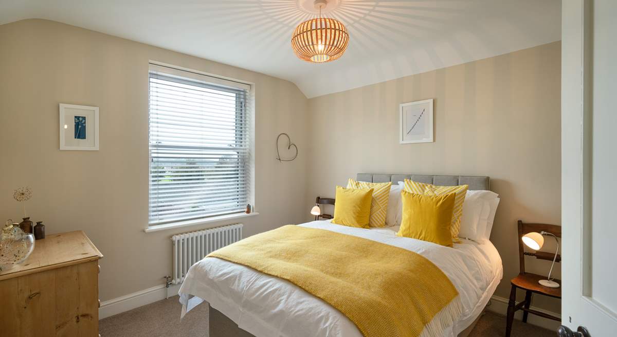 Mellow yellow in Bedroom 1 with double bed.