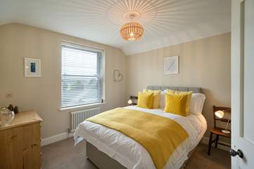 Mellow yellow in Bedroom 1 with double bed.