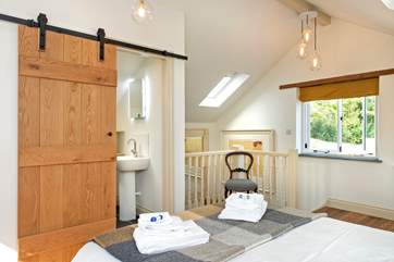 The stairs lead up into the bedroom (there is a door at the bottom of the stairs for privacy).