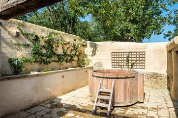 The setting for the hot tub has an almost Mediterranean feel - not bad for an old derelict barn!