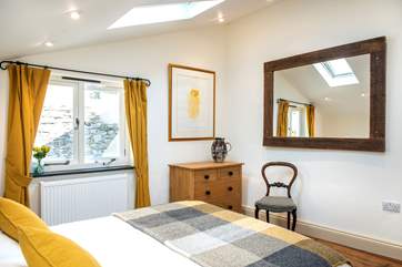 The cottage is beautifully furnished throughout with gorgeous artwork displayed on the walls.