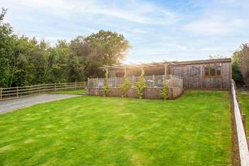 The large lawned area at the front will delight younger members and your four-legged friends.
