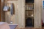 Plenty of storage for all your coats and boots and a toasty wood-burner effect electric stove, perfect for those out-of-season breaks.