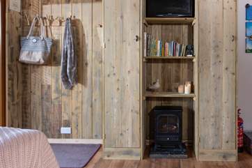 Plenty of storage for all your coats and boots and a toasty wood-burner effect electric stove, perfect for those out-of-season breaks.