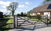 The entrance to Moorhen Cottage with gate that leads to a private garden and parking. - Thumbnail Image