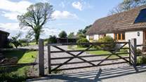 The entrance to Moorhen Cottage with gate that leads to a private garden and parking.