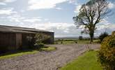 The parking area outside Moorhen Cottage which is also next door to the farm buildings. - Thumbnail Image