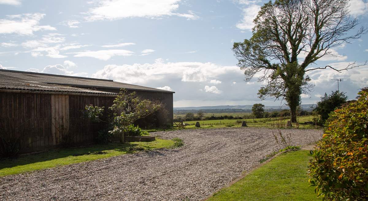 The parking area outside Moorhen Cottage which is also next door to the farm buildings.