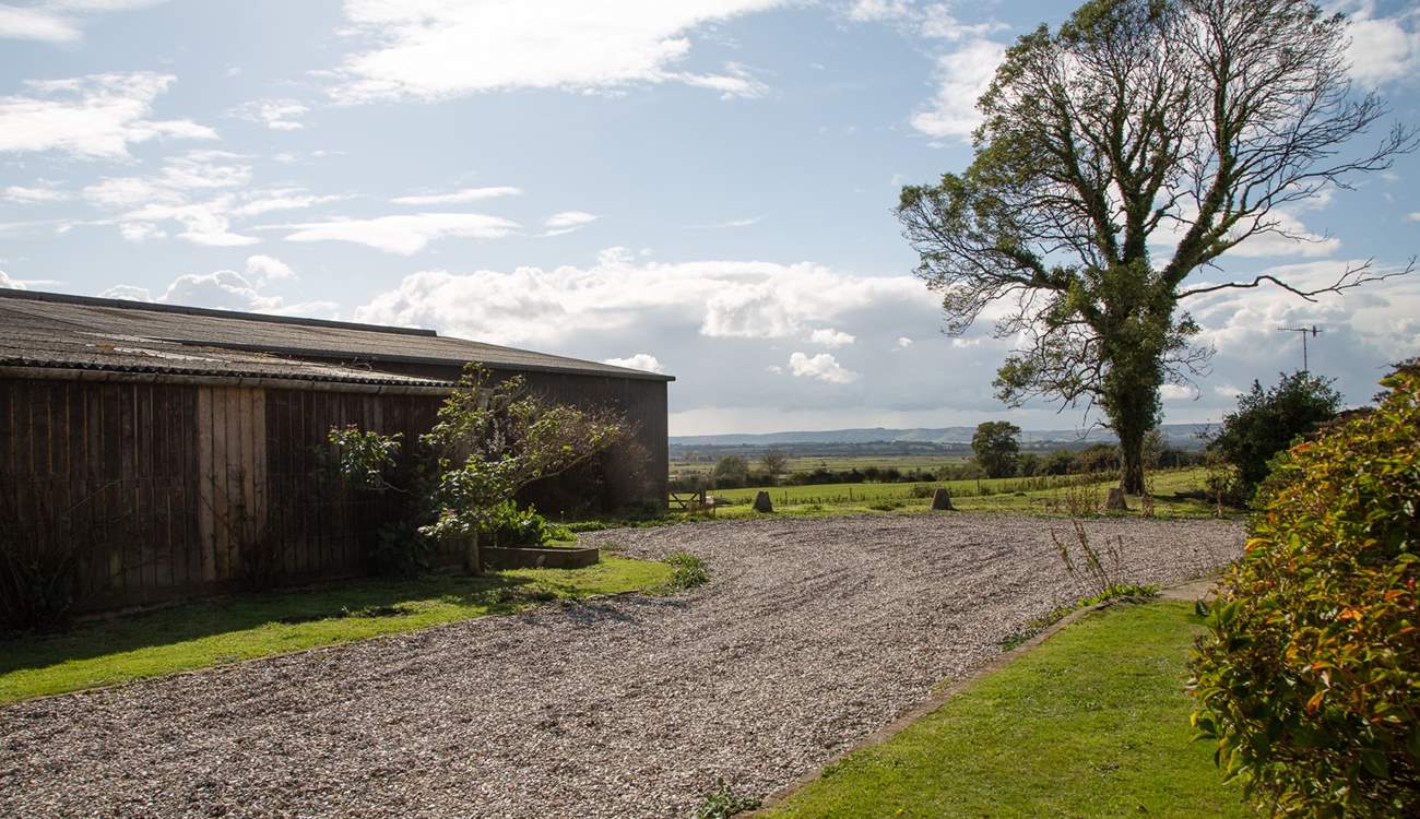 The parking area outside Moorhen Cottage which is also next door to the farm buildings.