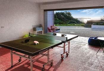 The garage doubles up as a games-room offering table-tennis and table-football. 