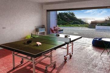 The garage doubles up as a games-room offering table-tennis and table-football.