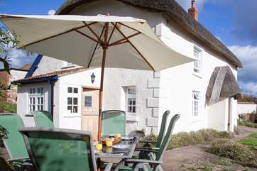 Enjoy the sun terrace; the perfect place for al fresco living with wonderful views from the enclosed garden.