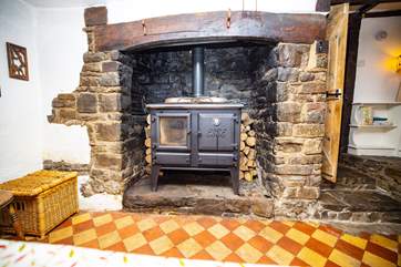 This old fireplace was where all the cooking was done, long before the days of gas or electricity! (This is no longer in use). The floor is also original, just one of the many features throughout this characterful house.