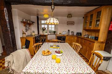 The dining-table sits in the middle of the kitchen and can comfortably sit seven making this the perfect spot to start and end the day.