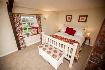 The main bedroom is at the front of the house and has delightful views of the countryside, best enjoyed from taking a seat in the window.
