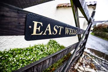East Wells is accessed through a gate, drive through and it will take you to the back of the house.