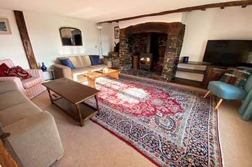 The sitting-room benefits from being a generous size with enough seating for all the family and everyone will enjoy the glow of the log-burner.