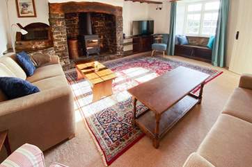 The sitting-room benefits from this wonderful wood-burner for those autumnal nights and not forgetting those wonderful views from the window seat.