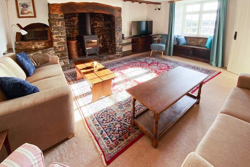 The sitting-room benefits from this wonderful wood-burner for those autumnal nights and not forgetting those wonderful views from the window seat.